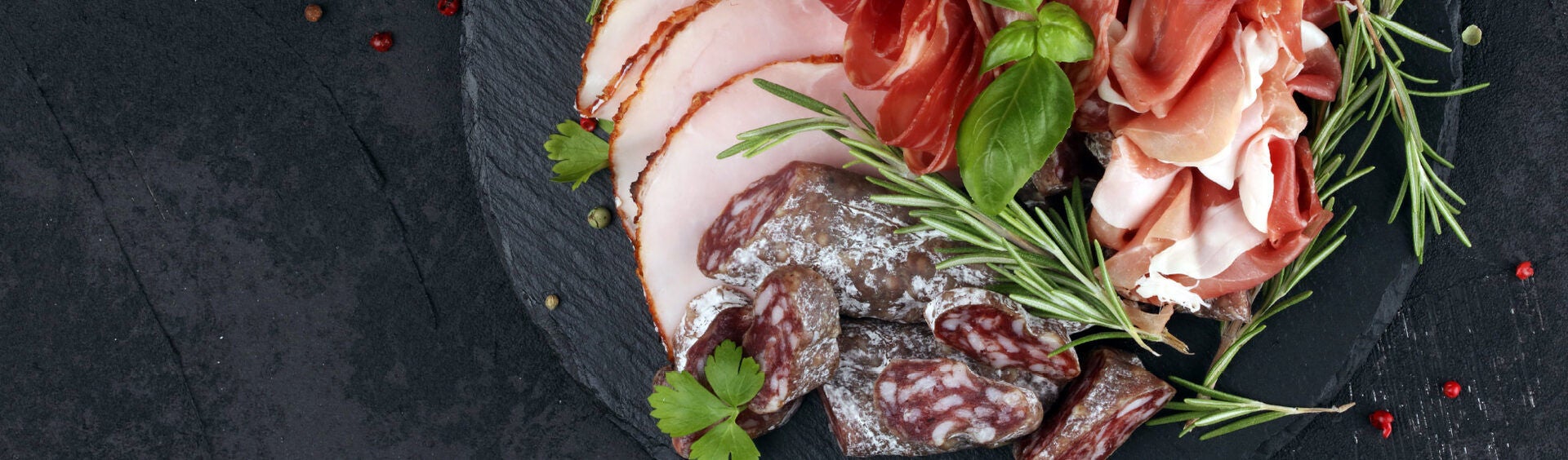 Charcuterie Platter with Fresh Herbs on Slate