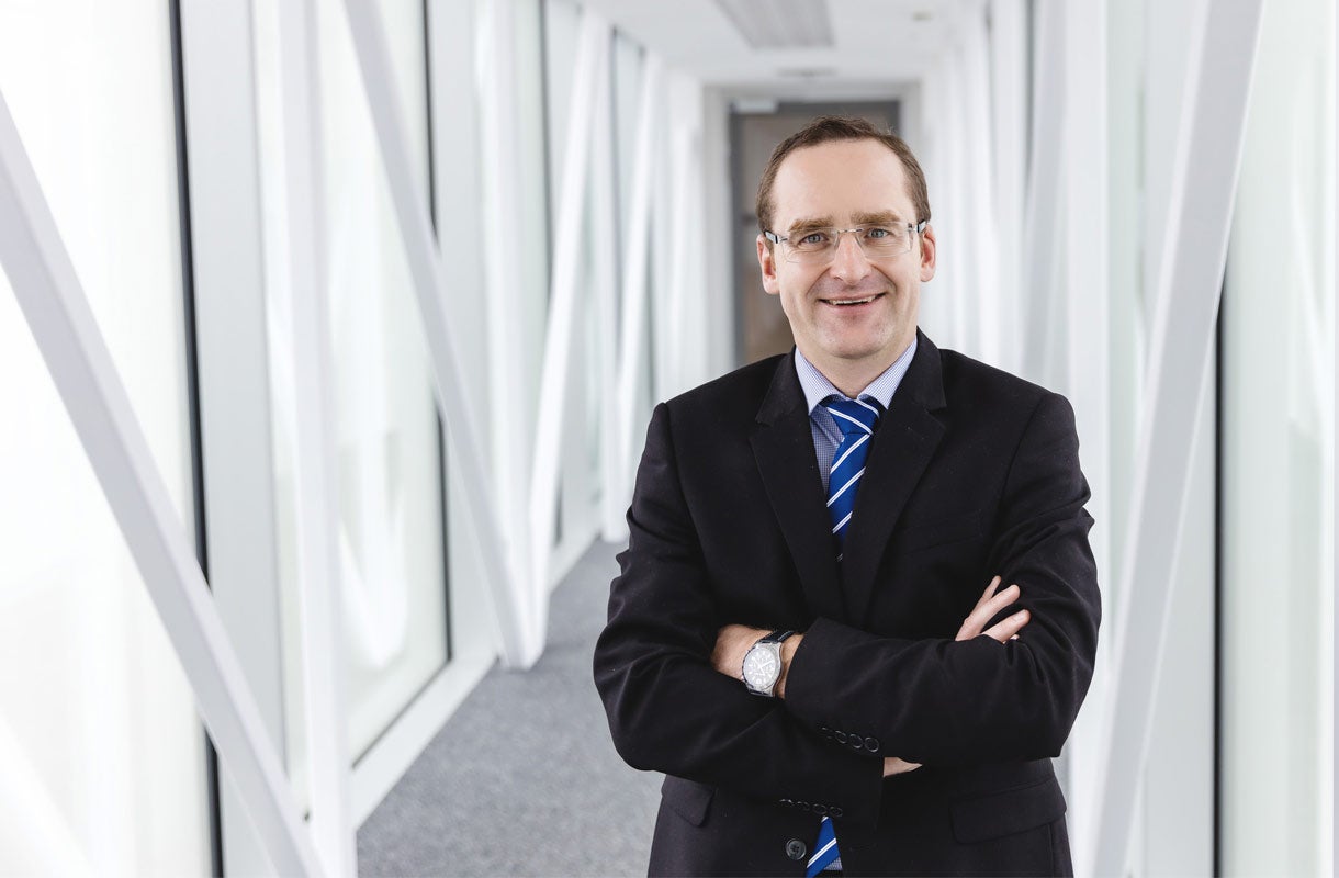 Business Professional in Modern Office Corridor